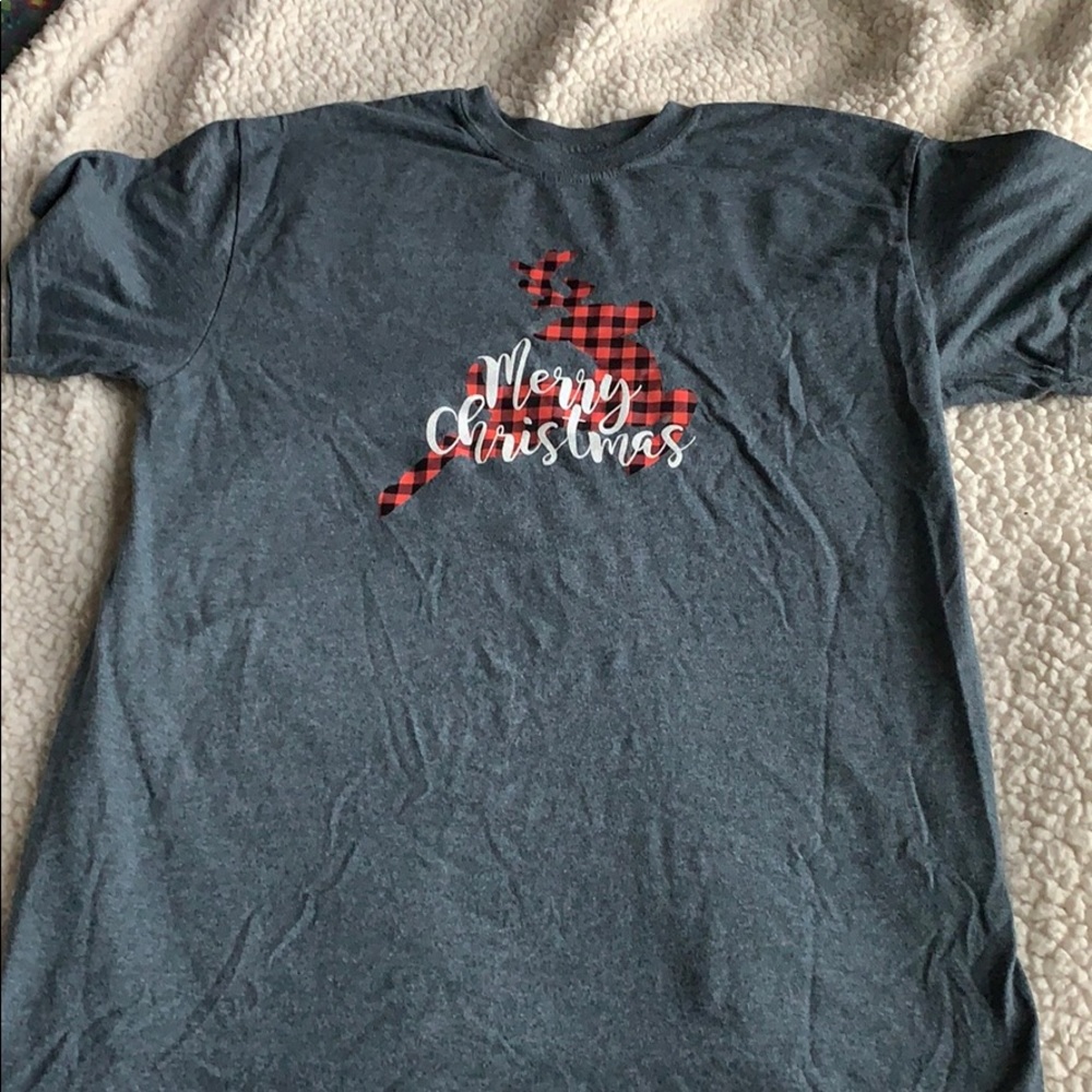 Red , black , white & grey rain deer shirt .